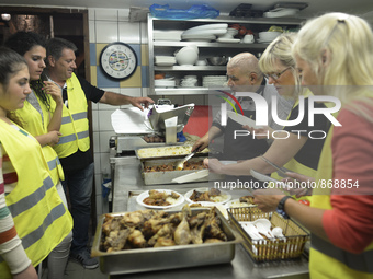 Michael Pastrikos (third from the left), the Aspa Boomerang Restaurant owner, helped by his family members, his staff and many international...