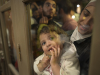 A young girl is looking trough the door as her family is awaiting to enter to the Aspa Boomerang Restaurant, as the owner Michael Pastrikos,...