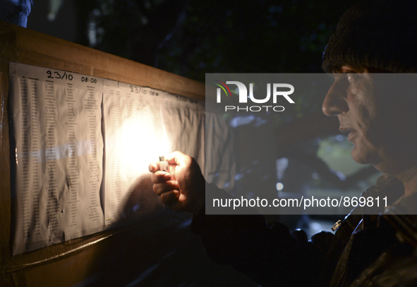 A refugee is checking the list for the registration by Police, outside the Police station in Kos Town.
Kos town, Kos Island, Greece, on Octo...