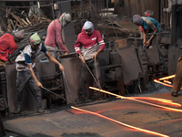 Laborers during work at a metal workshop at Postogola Area in Dhaka, Bangladesh on August 22, 2022.  (