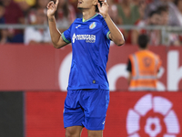 Enes Unal centre-forward of Getafe and Turkey celebrates after scoring his sides first goal during the La Liga Santander match between Giron...