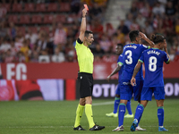 Fabrizio Angileri left-back of Getafe and Argentina is shown a red card during the La Liga Santander match between Girona FC and Getafe CF a...