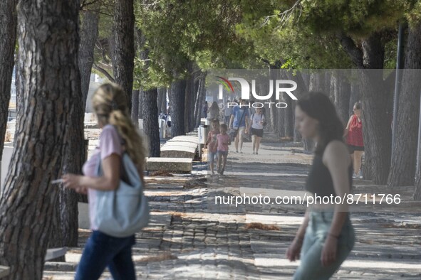 People are seen performing outdoor activities in the surroundings of the Tejo river promenade in Oriente. Lisbon, August 23, 2022. Portugal...