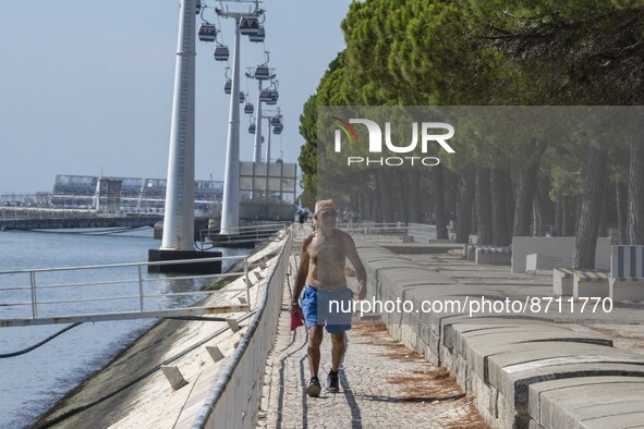 People are seen performing outdoor activities in the surroundings of the Tejo river promenade in Oriente. Lisbon, August 23, 2022. Portugal...