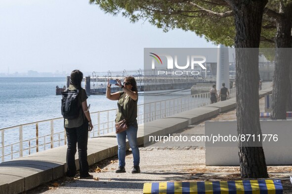 People are seen performing outdoor activities in the surroundings of the Tejo river promenade in Oriente. Lisbon, August 23, 2022. Portugal...