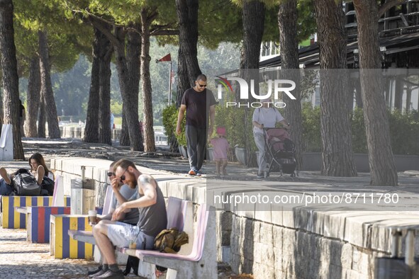 People are seen performing outdoor activities in the surroundings of the Tejo river promenade in Oriente. Lisbon, August 23, 2022. Portugal...