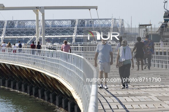 People are seen performing outdoor activities in the surroundings of the Tejo river promenade in Oriente. Lisbon, August 23, 2022. Portugal...