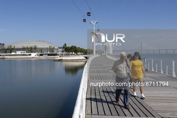 People are seen performing outdoor activities in the surroundings of the Tejo river promenade in Oriente. Lisbon, August 23, 2022. Portugal...