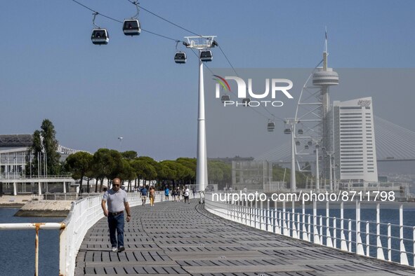 People are seen performing outdoor activities in the surroundings of the Tejo river promenade in Oriente. Lisbon, August 23, 2022. Portugal...