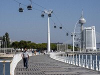 People are seen performing outdoor activities in the surroundings of the Tejo river promenade in Oriente. Lisbon, August 23, 2022. Portugal...