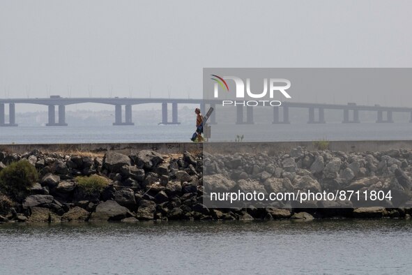 People are seen performing outdoor activities in the surroundings of the Tejo river promenade in Oriente. Lisbon, August 23, 2022. Portugal...