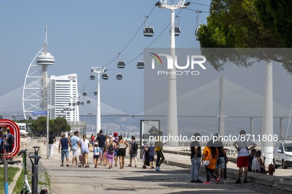 People are seen performing outdoor activities in the surroundings of the Tejo river promenade in Oriente. Lisbon, August 23, 2022. Portugal...