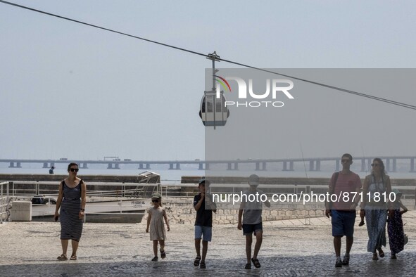 People are seen performing outdoor activities in the surroundings of the Tejo river promenade in Oriente. Lisbon, August 23, 2022. Portugal...