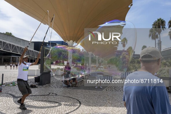 People are seen performing outdoor activities in the surroundings of the Tejo river promenade in Oriente. Lisbon, August 23, 2022. Portugal...