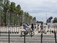 People are seen performing outdoor activities in the surroundings of the Tejo river promenade in Oriente. Lisbon, August 23, 2022. Portugal...