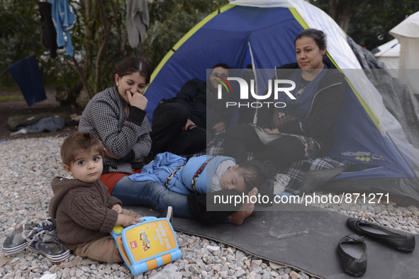 A family of migrants from Syria, in Kos camp, near the main Police station, as hundreds of new arrived migrants awaiting on a daily basis to...