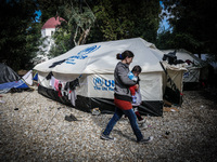 A family in a camp in Kos, Greece, on October 25, 2015. More than 700,000 refugees and migrants have reached Europe's Mediterranean shores s...