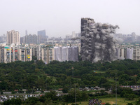 The Supertech Twin Towers collapse following a controlled demolition by explosion after the Supreme Court found them in violation of buildin...