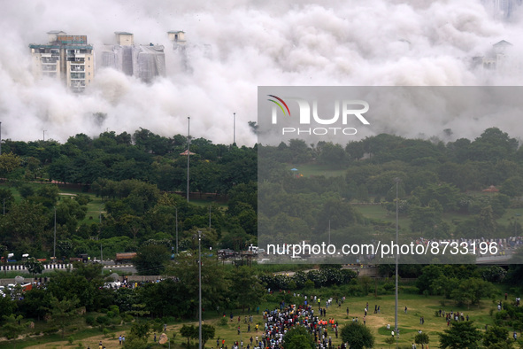 The Supertech Twin Towers collapse making a cloud of dust following a controlled demolition by explosion after the Supreme Court found them...