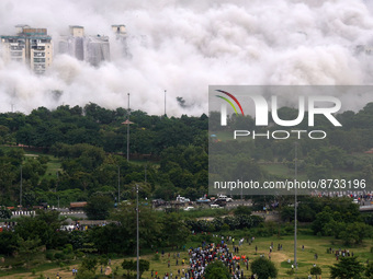 The Supertech Twin Towers collapse making a cloud of dust following a controlled demolition by explosion after the Supreme Court found them...