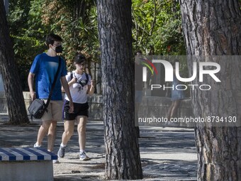 People are seen performing outdoor activities in the surroundings of the Tejo river promenade in Oriente. Lisbon, August 23, 2022. The manda...