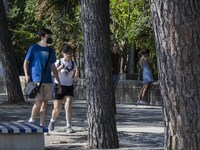 People are seen performing outdoor activities in the surroundings of the Tejo river promenade in Oriente. Lisbon, August 23, 2022. The manda...