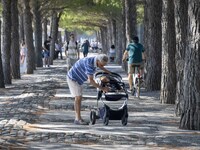 People are seen performing outdoor activities in the surroundings of the Tejo river promenade in Oriente. Lisbon, August 23, 2022. The manda...