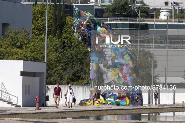 People are seen performing outdoor activities in the surroundings of the Tejo river promenade in Oriente. Lisbon, August 23, 2022. The manda...