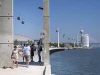 People are seen performing outdoor activities in the surroundings of the Tejo river promenade in Oriente. Lisbon, August 23, 2022. The manda...