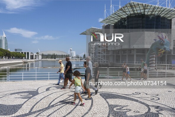 People are seen performing outdoor activities in the surroundings of the Tejo river promenade in Oriente. Lisbon, August 23, 2022. The manda...