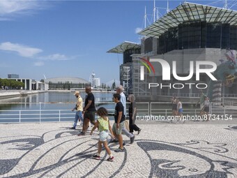 People are seen performing outdoor activities in the surroundings of the Tejo river promenade in Oriente. Lisbon, August 23, 2022. The manda...