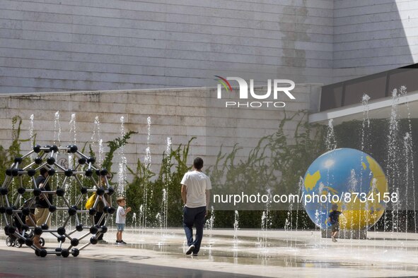 People are seen performing outdoor activities in the surroundings of the Tejo river promenade in Oriente. Lisbon, August 23, 2022. The manda...