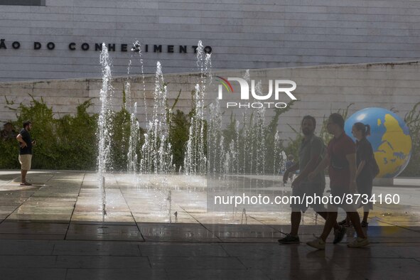 People are seen performing outdoor activities in the surroundings of the Tejo river promenade in Oriente. Lisbon, August 23, 2022. The manda...