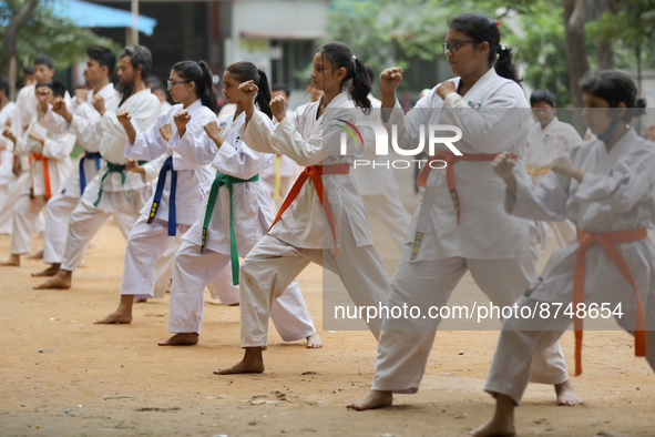 Students practice martial arts on the playground of a school in Dhaka, Bangladesh on August 30, 2022.  