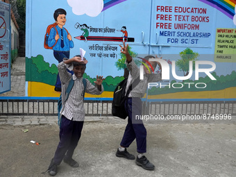 Students react as they go back to their homes after attending school classes in New Delhi on August 30, 2022. (