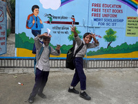 Students react as they go back to their homes after attending school classes in New Delhi on August 30, 2022. (