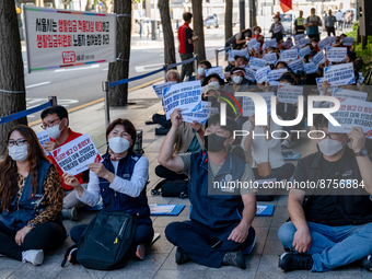 Workers at the KCTU(Korean Confederation of Trade Unions)'s Seoul headquarters shout slogans during a rally calling for better working condi...