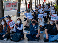 Workers at the KCTU(Korean Confederation of Trade Unions)'s Seoul headquarters shout slogans during a rally calling for better working condi...