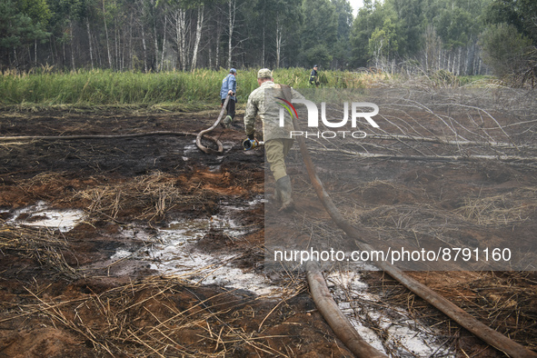 Rescuers are extinguishing Peat soil fires near the village of Sosnivka in the Kyiv Region, Ukraine September 6, 2022 