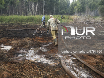 Rescuers are extinguishing Peat soil fires near the village of Sosnivka in the Kyiv Region, Ukraine September 6, 2022 (