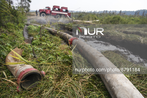 A fire truck during extinguishing Peat soil fires near the village of Sosnivka in the Kyiv Region, Ukraie September 6, 2022 