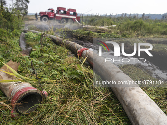 A fire truck during extinguishing Peat soil fires near the village of Sosnivka in the Kyiv Region, Ukraie September 6, 2022 (