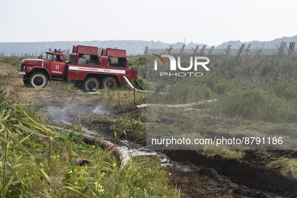 A fire truck during extinguishing Peat soil fires near the village of Sosnivka in the Kyiv Region, Ukraie September 6, 2022 