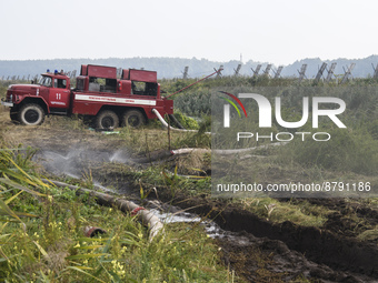 A fire truck during extinguishing Peat soil fires near the village of Sosnivka in the Kyiv Region, Ukraie September 6, 2022 (