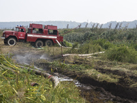 A fire truck during extinguishing Peat soil fires near the village of Sosnivka in the Kyiv Region, Ukraie September 6, 2022 (