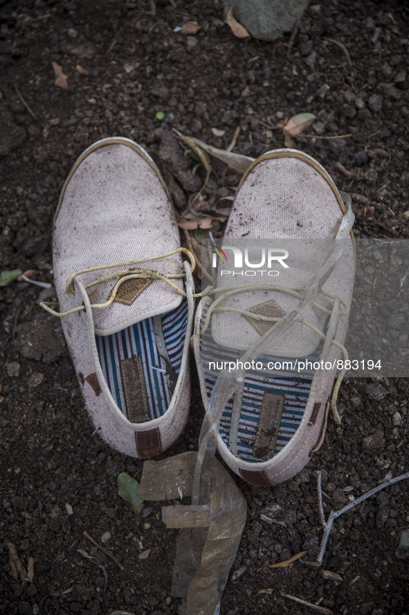 Men's canvas boat shoes found near Skala Sikaminias on the island of Lesbos.  Shoes found on the beaches and around the Greek island where t...