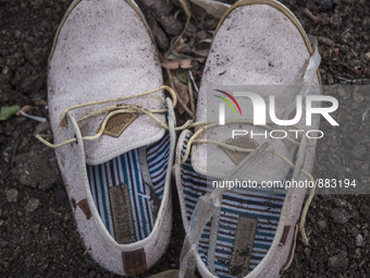 Men's canvas boat shoes found near Skala Sikaminias on the island of Lesbos.  Shoes found on the beaches and around the Greek island where t...