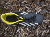 Boy's leather soccer shoe found near Skala Sikaminias on the island of Lesbos.  Shoes found on the beaches and around the Greek island where...