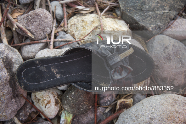 Woman's patent-leather mule found near Skala Sikaminias on the island of Lesbos.  Shoes found on the beaches and around the Greek island whe...