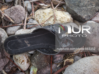 Woman's patent-leather mule found near Skala Sikaminias on the island of Lesbos.  Shoes found on the beaches and around the Greek island whe...